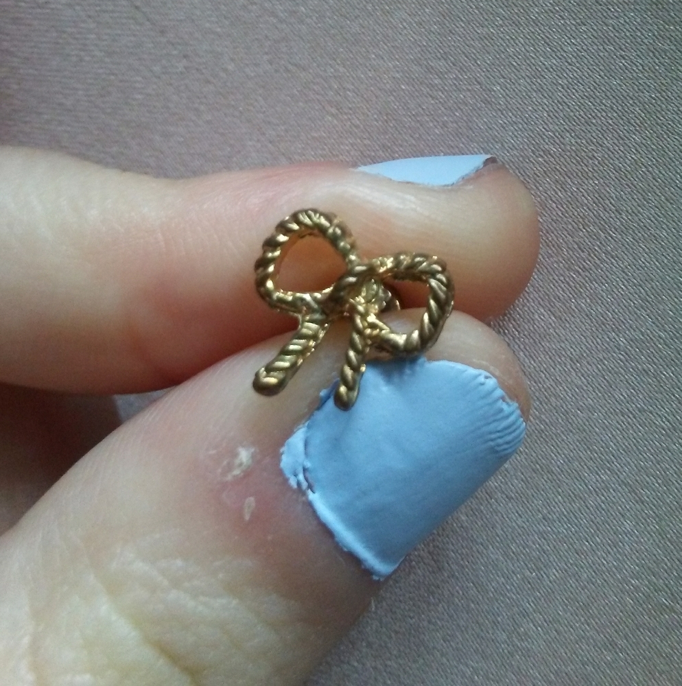 Gold tone ribbon earrings